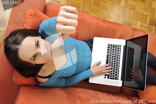 Image of woman using a laptop computer at home