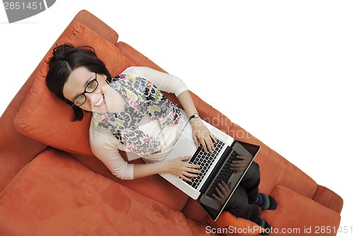 Image of woman using a laptop computer at home