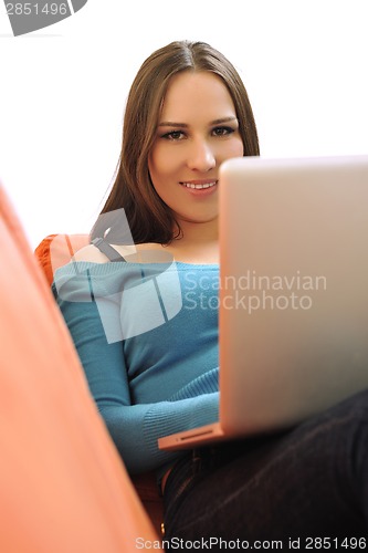 Image of woman using a laptop computer at home