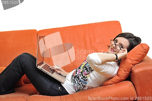 Image of woman using a laptop computer at home
