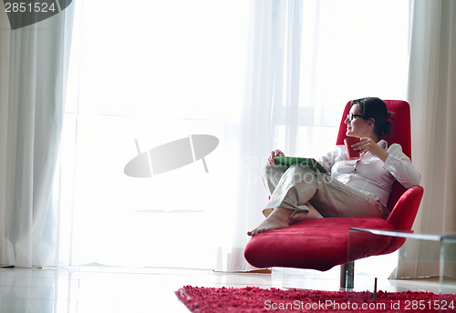 Image of woman using tablet pc at home