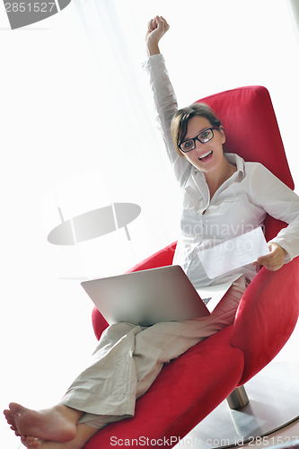 Image of woman using a laptop computer at home