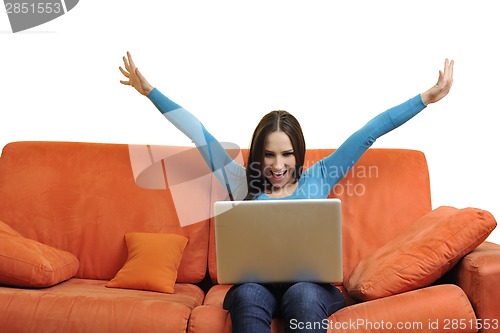 Image of woman using a laptop computer at home