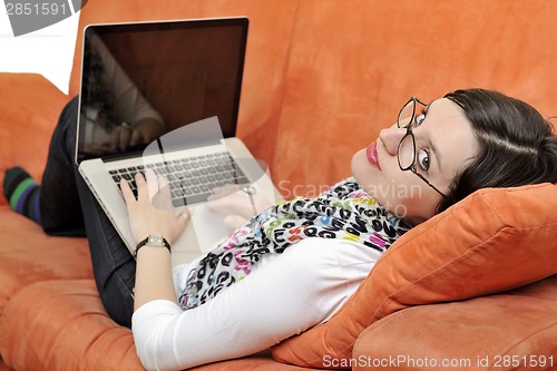 Image of woman using a laptop computer at home
