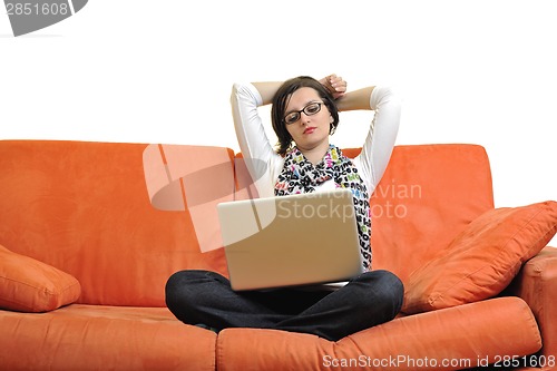 Image of woman using a laptop computer at home