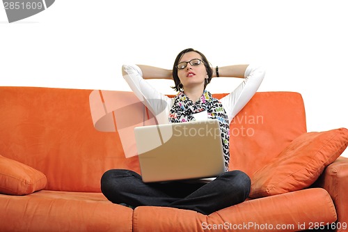 Image of woman using a laptop computer at home