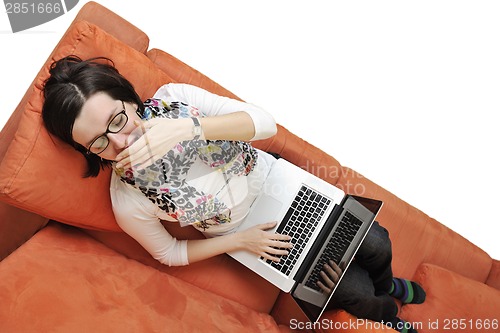 Image of woman using a laptop computer at home