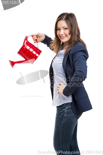 Image of Businesswoman watering 