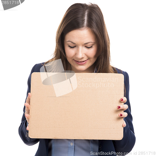 Image of Business woman holding a cardboard
