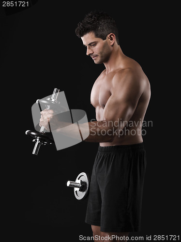 Image of Muscular man lifting weights