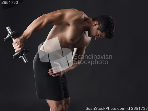 Image of Muscular man lifting weights