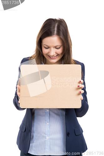 Image of Business woman holding a cardboard