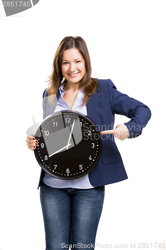 Image of Business woman holding a big clock