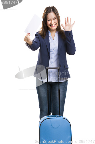 Image of Business woman carrying a suitcase