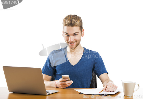 Image of Young man sending text messages