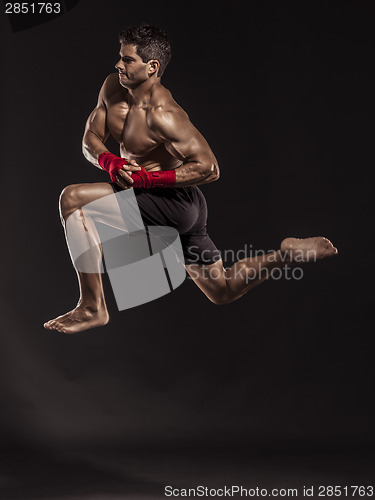 Image of Man practicing body combat