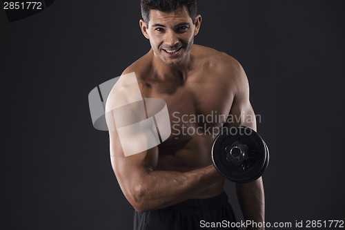 Image of Muscular man lifting weights
