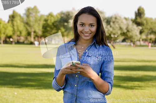 Image of Beautiful woman talking at phone