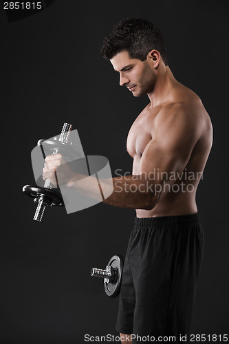 Image of Muscular man lifting weights
