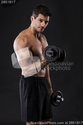 Image of Muscular man lifting weights