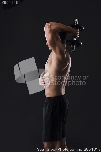 Image of Muscular man lifting weights