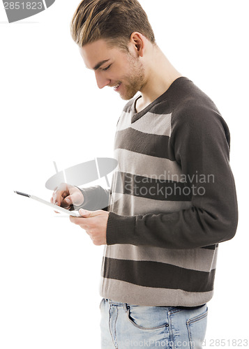 Image of Young man working with a tablet
