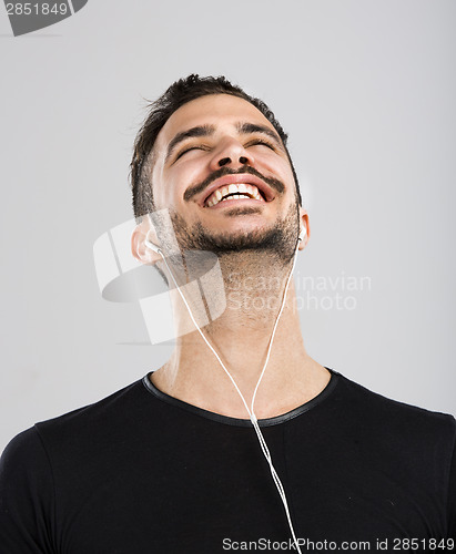 Image of Happy man listen music