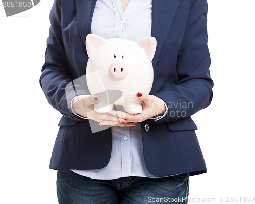 Image of Business woman with a piggy bank