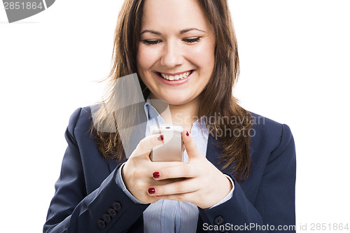 Image of Business woman with a cellphone texting