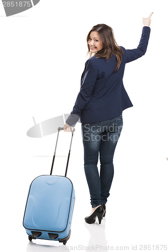 Image of Business woman carrying a suitcase