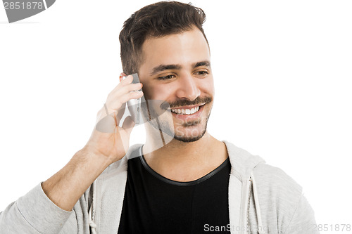 Image of Young man talking on cell phone