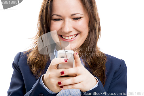Image of Business woman with a cellphone texting