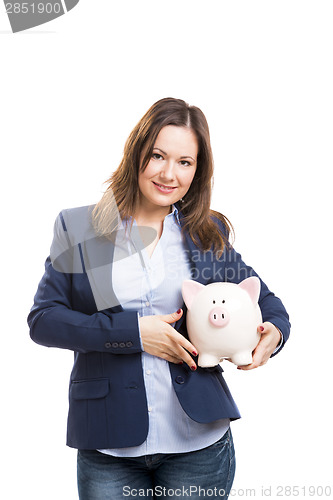 Image of Business woman with a piggy bank