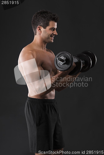 Image of Muscular man lifting weights