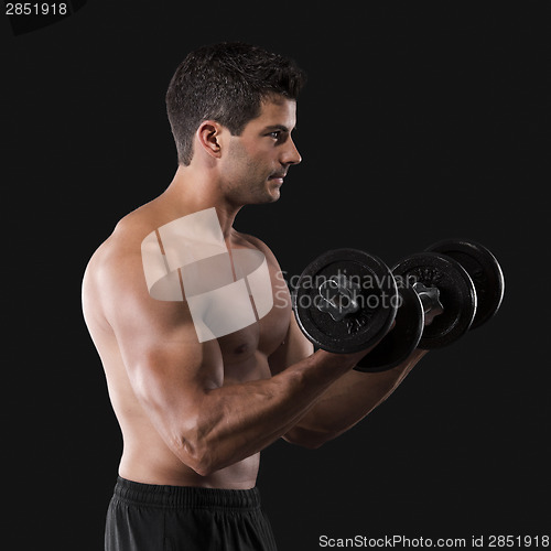 Image of Muscular man lifting weights