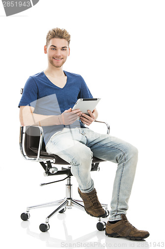 Image of Young man working with a tablet