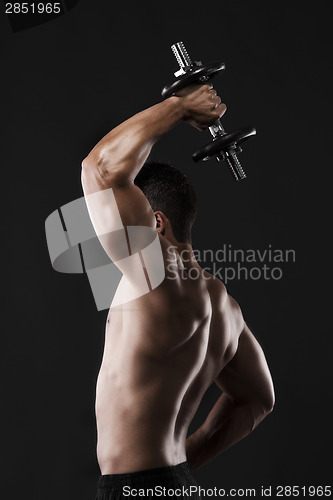 Image of Muscular man lifting weights