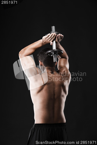 Image of Muscular man lifting weights