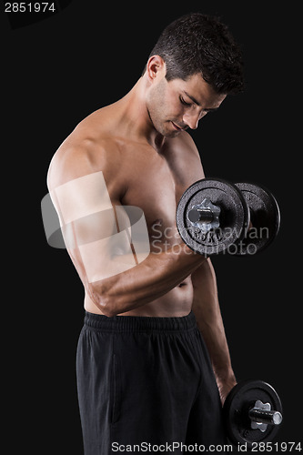 Image of Muscular man lifting weights