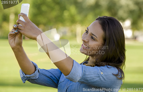 Image of Beautiful woman taking a photo