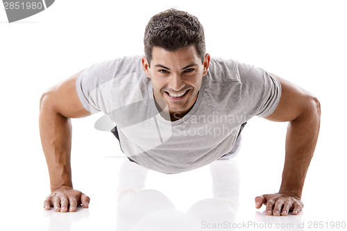 Image of Handsome young man making pushups