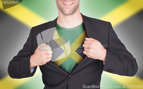 Image of Businessman opening suit to reveal shirt with flag