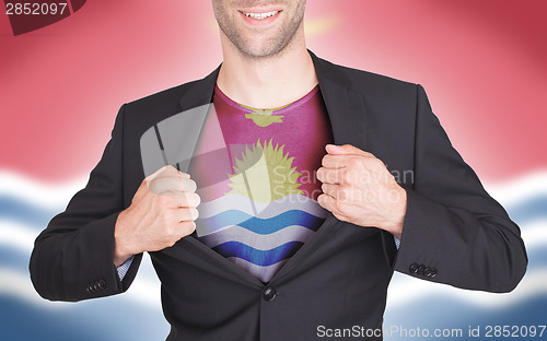 Image of Businessman opening suit to reveal shirt with flag