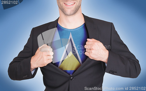 Image of Businessman opening suit to reveal shirt with flag