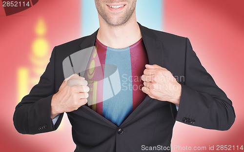 Image of Businessman opening suit to reveal shirt with flag