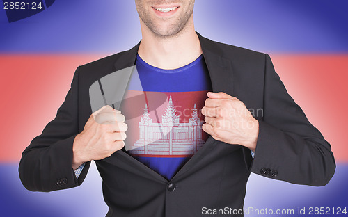 Image of Businessman opening suit to reveal shirt with flag