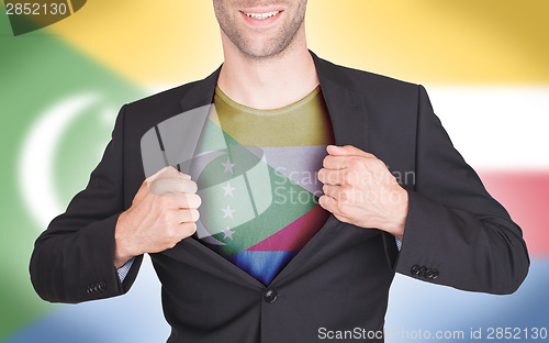 Image of Businessman opening suit to reveal shirt with flag