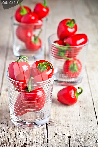 Image of red hot chilli peppers in glasses