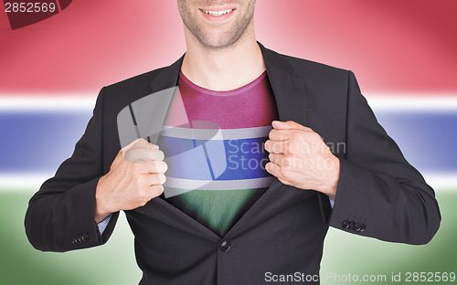 Image of Businessman opening suit to reveal shirt with flag