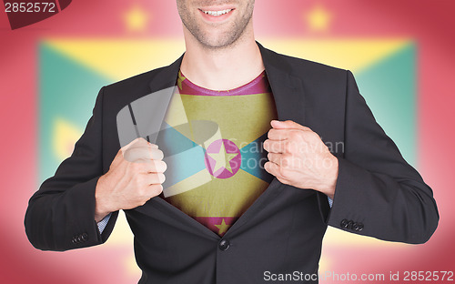 Image of Businessman opening suit to reveal shirt with flag